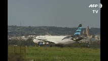 PHOTO - Libyan plane hijacked, lands in Malta - PM-sUQpo-jVvqo
