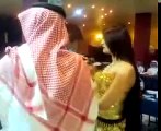 Sheikh throwing money on belly dancer in a UAE Nightclub