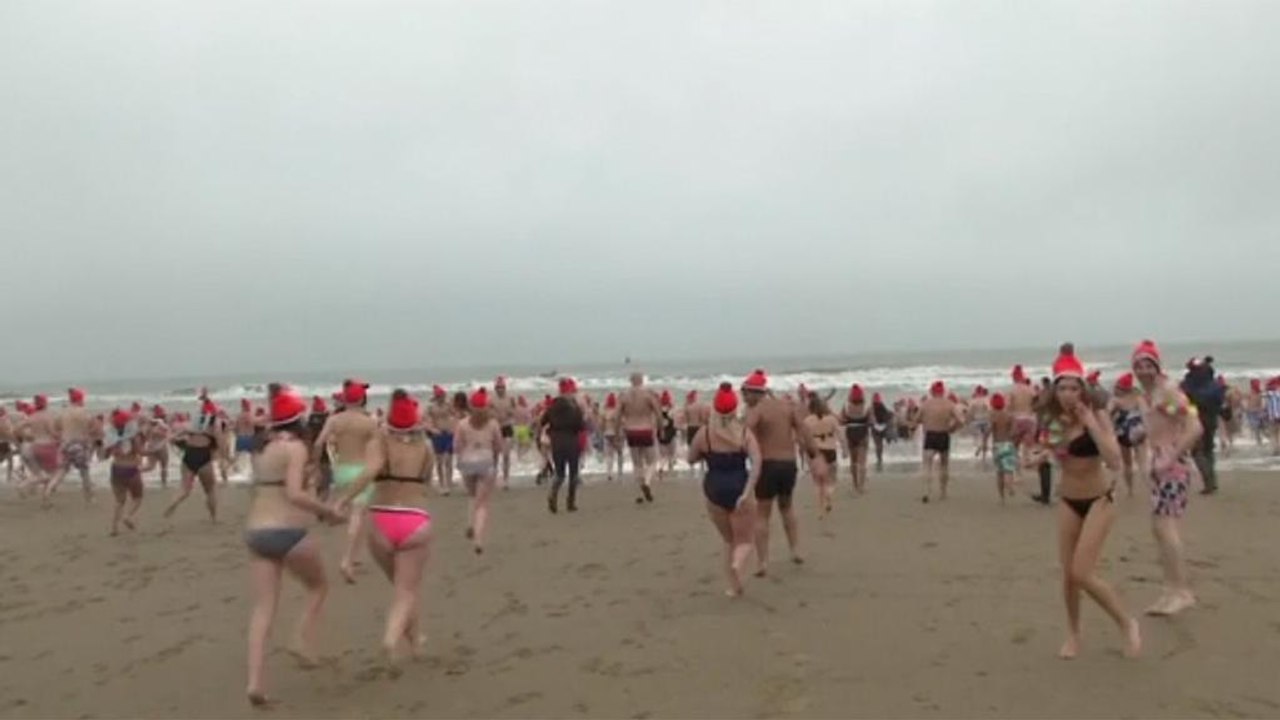 Hundreds take New Year plunge in Dutch seaside town