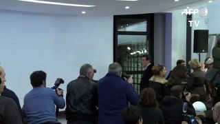 Candidates shake hands as Fillon wins French right-wing primary-TbB6zs4c7i0