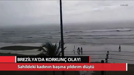 Скачать видео: Sahildeki kadının başına yıldırım düşme anı