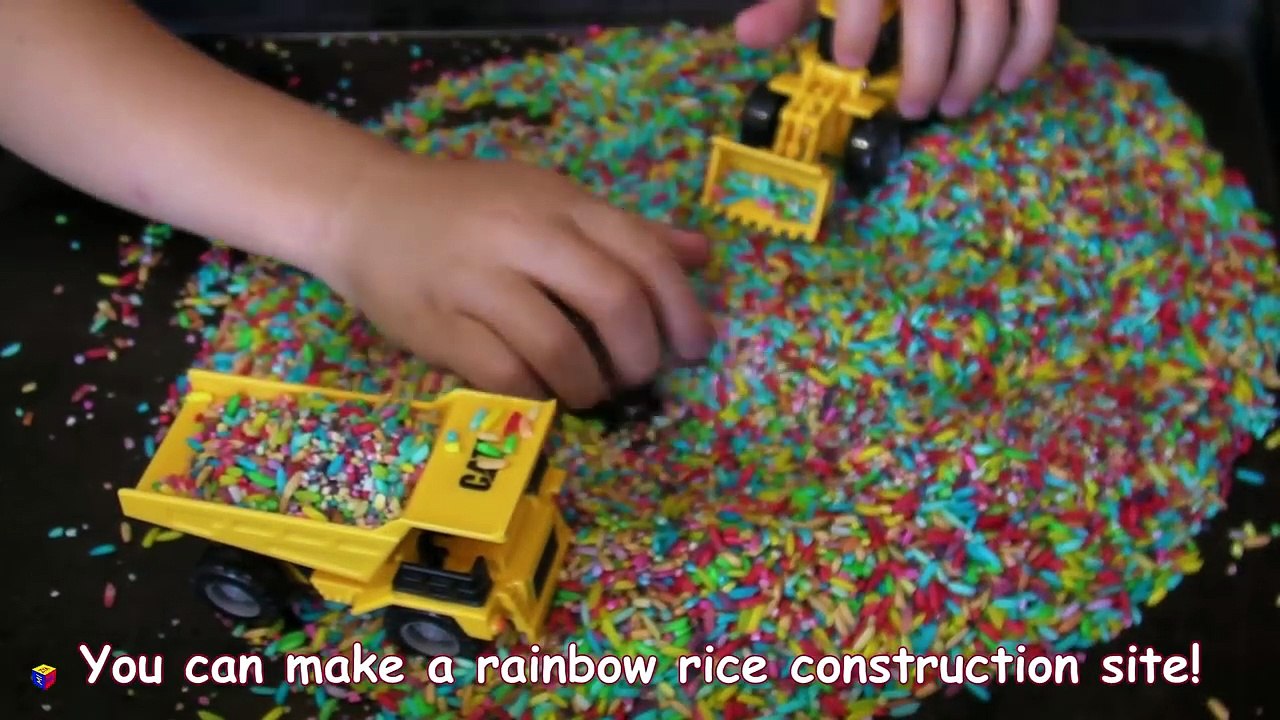 Trucks for children kids. Toy construction trucks. Sensory activity for toddlers - rainbow rice.-AMZym5T9Q98