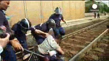 Distraught Syria refugee pulls wife and baby onto train tracks, Hungary