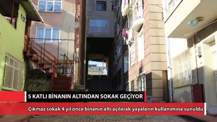 5 katlı binanın altından sokak geçiyor