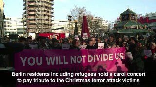 Berlin refugees hold carol concert following terror attack