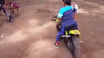 whatsapp latest funny videos small kid showing stunts on his mini bike