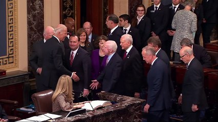 Biden snaps selfies and charms children at Senate swear in