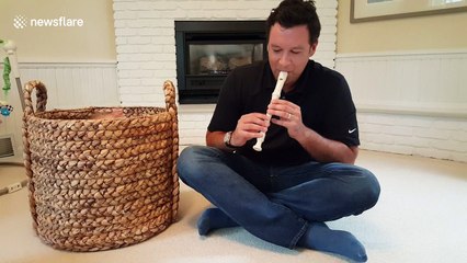 Father 'snake charms' his daughter out of a basket