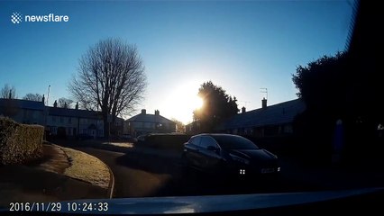 Driver spots car with child at the back travelling with open door