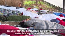 Migrants camp outside Paris shelter hoping to get in