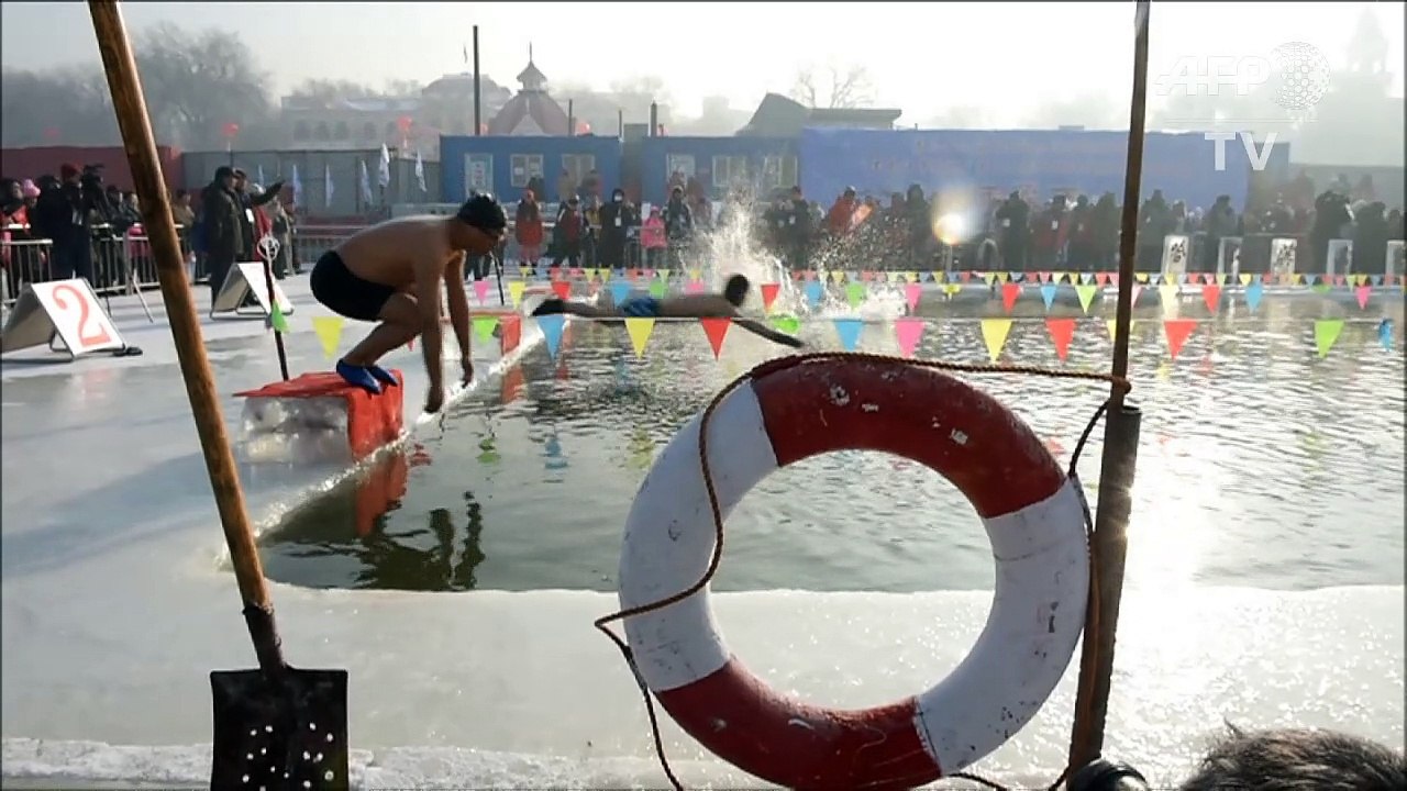 Chinese swimmers brave freezing waters at ice a...