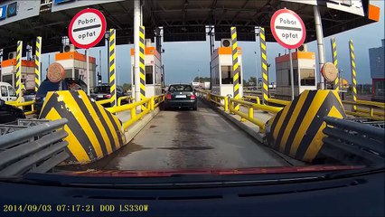 Woman on the gate for toll collection