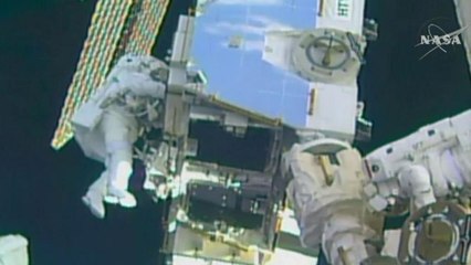 Astronauts boost space station's power supply