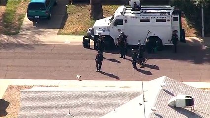 Pug picks fight with police dog outside Phoenix barricade