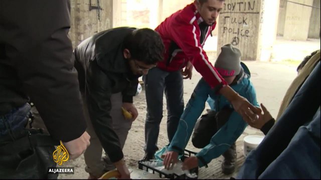 Refugees in Greece defy extreme cold to help the homeless