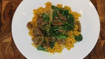 Turmeric barley with caramelized onion, beef and spinach