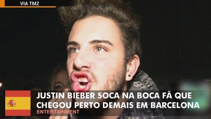 Justin Bieber soca boca de fã que chegou perto demais em Barcelona.