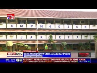 Polisi Jaga Ujian Nasional di SMPN 40 Pejompongan