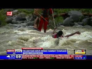 Video herunterladen: Hujan dan Arus Deras Hambat Evakuasi Korban Terjebak Banjir