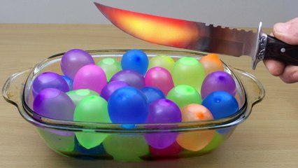 EXPERIMENT Glowing 1000 degree KNIFE vs WATER BALLOONS