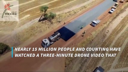 Just look at how quickly this crew paves a road!