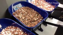 Businessman pays DMV tax bill with wheelbarrows of pennies