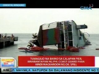 UB: Tumagilid na barko sa Calapan Pier, binabantayan ng PCG para hindi magkaroon ng oil spill