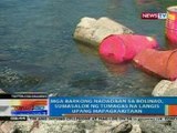 Mga barkong nadadaan sa Bolinao, sumasalok ng tumagas na langis upang mapagkakitaan