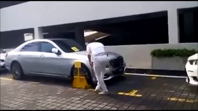 Viral video: car owner beats security guard over clamped tyre
