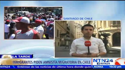 Скачать видео: Miles de activistas marchan para exigir una amnistía migratoria a favor de los indocumentados en Chile