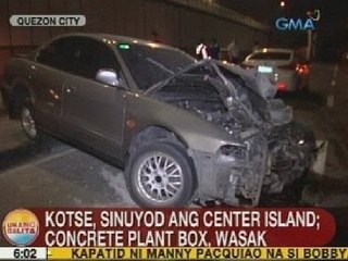 UB: Kotse, sinuyod ang center island sa QC; concrete plant box, wasak
