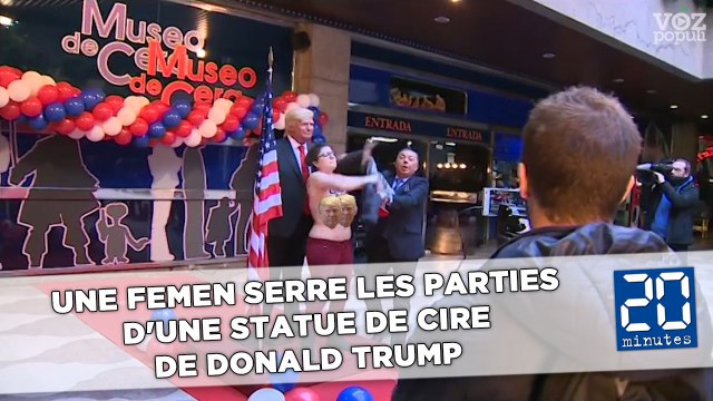 Une Femen serre les parties d'une statue de cire de Donald Trump