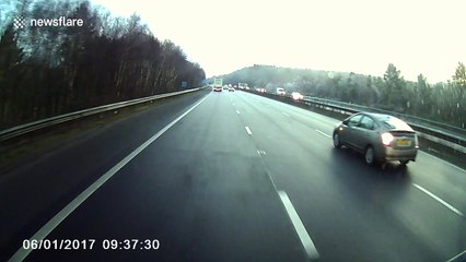 Man thrown out of car after hitting central reservation on M23