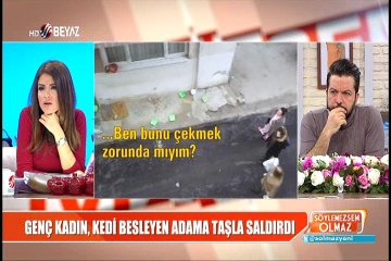 Genç kadın, kedi besleyen adama taşla saldırdı