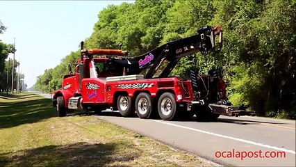 Fatal crash Semi and SUV; tow truck driver nearly injured when chain snapped