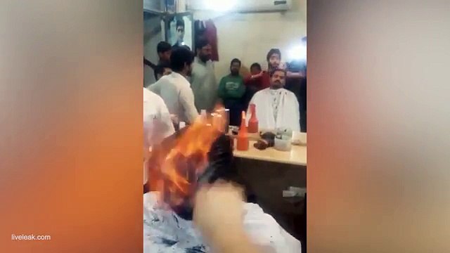 Indian barber's firey haircut draws onlookers