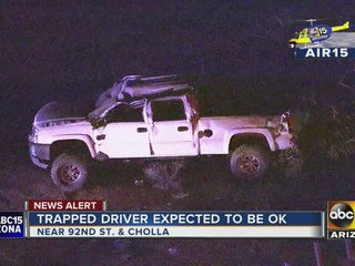 A person is hospitalized after being trapped in car after Scottsdale rollover crash