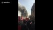 The moment a high-rise building collapsed in Tehran, trapping firefighters inside