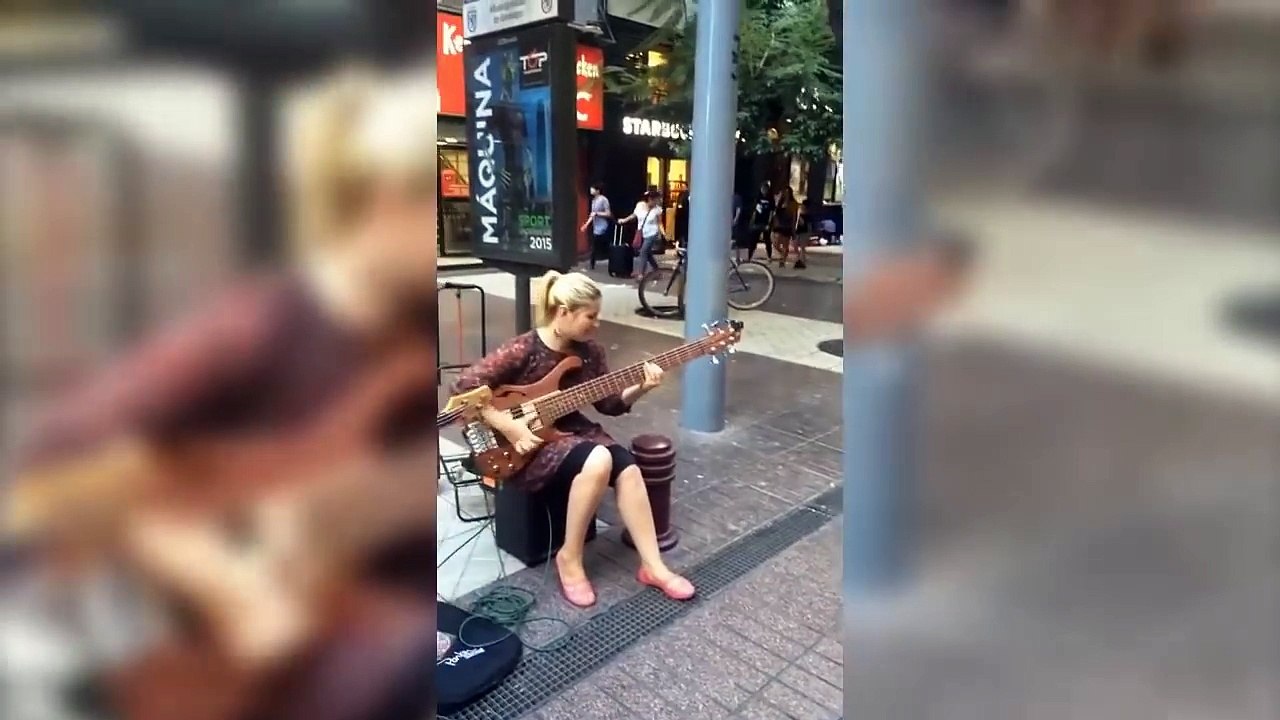 Girl street performer slams Bass like a pro