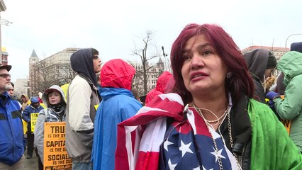 Protesters gather along inauguration parade route