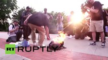 RAW- Scuffle breaks out after flag burns during police protest