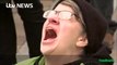 An anti-Trump protester screams 'no' as Donald Trump is sworn in as the 45th US President