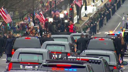 Trumps walk down Pennsylvania Avenue during parade