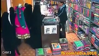 Claver Thief Womens Doing Theft in Clothes Shop