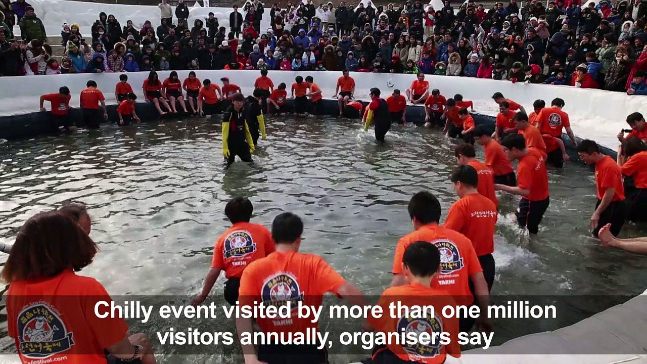 Bare-hand fishing, sledding at South Korean ice festival