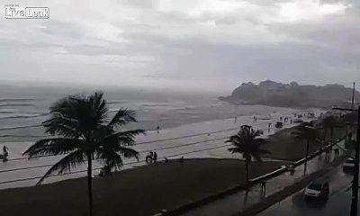LiveLeak - Exact Moment when Tourist is hit by lightning at a beach in Brazil