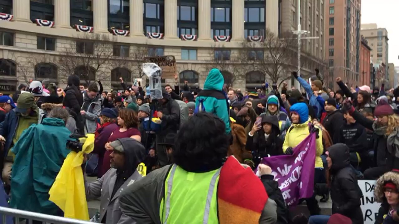 Protesters take a knee as National Anthem is played at Donald Trump inauguration