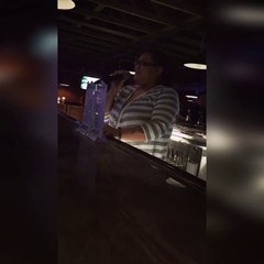 Local bartender sings beautifully .
