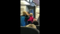 RAW_ Watch intense confrontation between passengers, American Airlines flight attendant