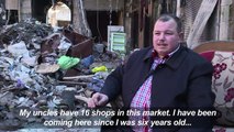 Aleppo traders clear debris from war-scarred souk